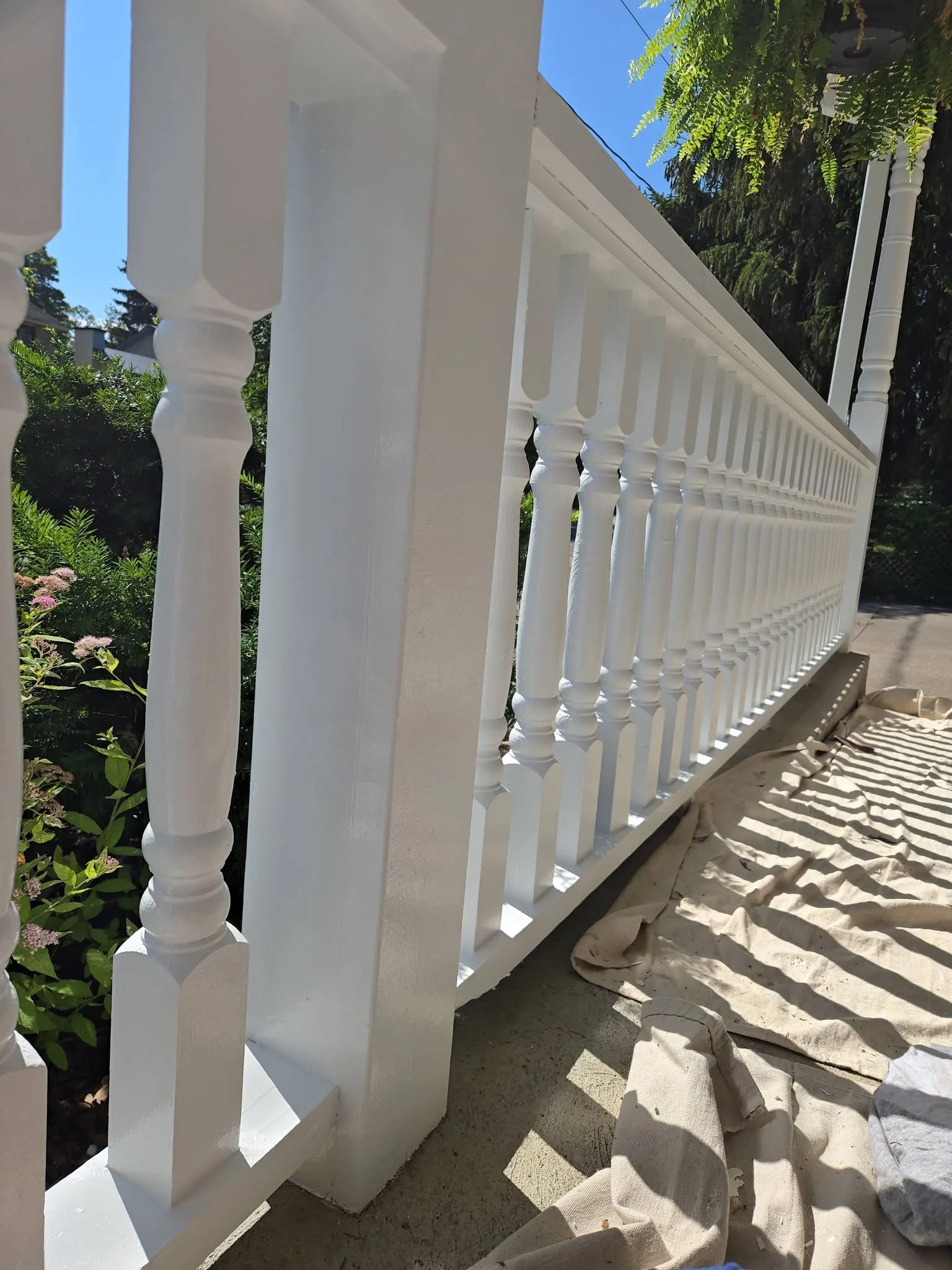 White painted porch rails and posts.